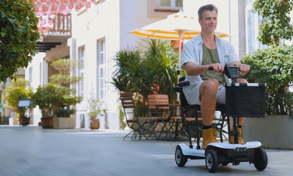 Man driving a scooter on the street