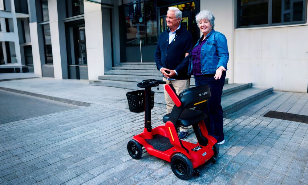 Elderly people look at 4-wheel scooters