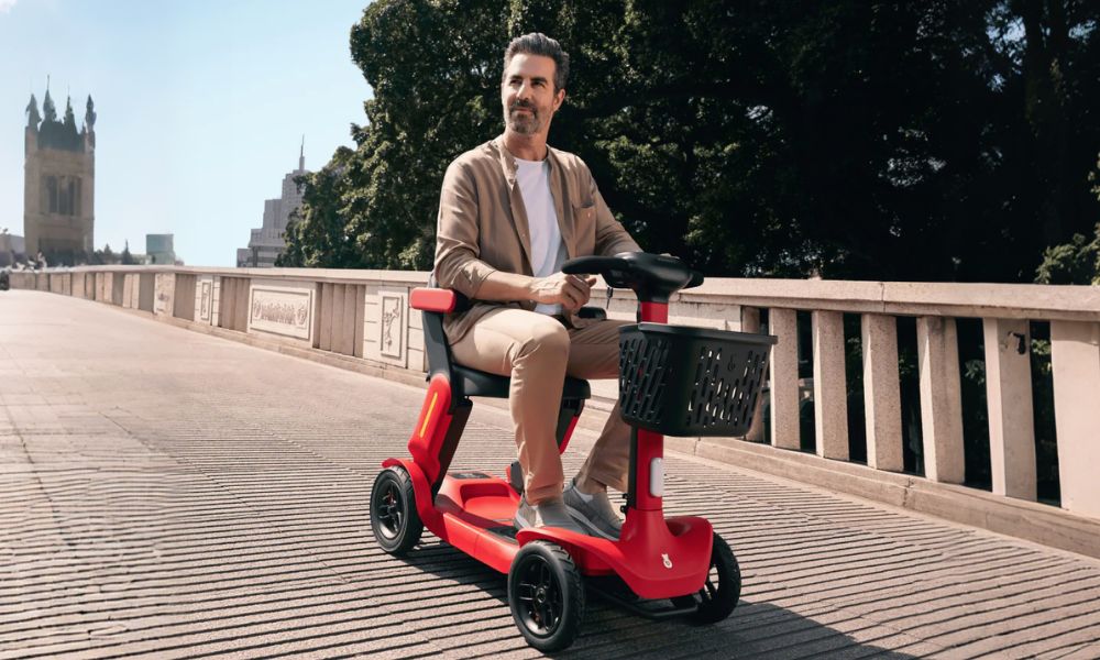 Man riding a 4-wheel electric scooter