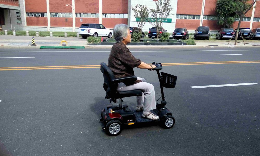 Elderly people using electric scooters