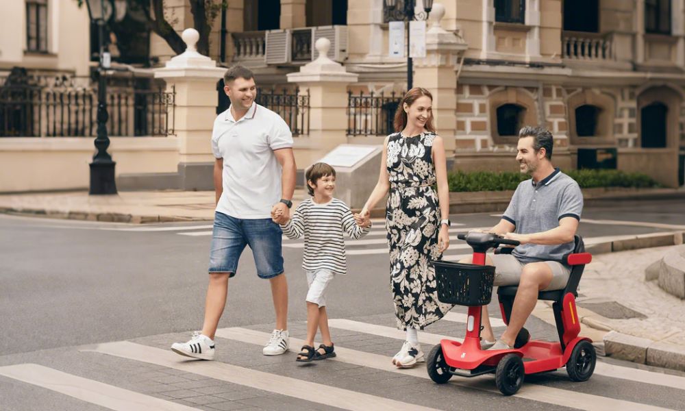 Riding a mobility scooter on the sidewalk