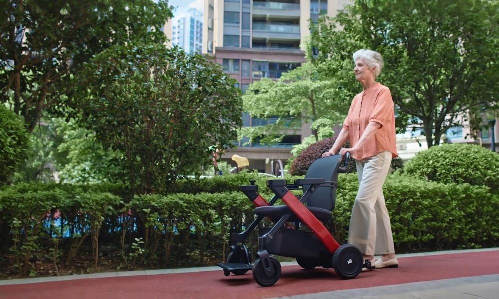 Elderly lady pushing a motorized wheelchair