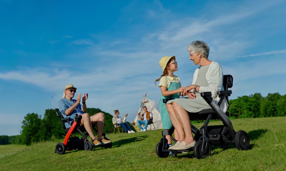 Man takes elderly person out in wheelchair