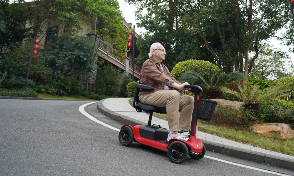 Elderly people driving a 4-wheel scooter downhill